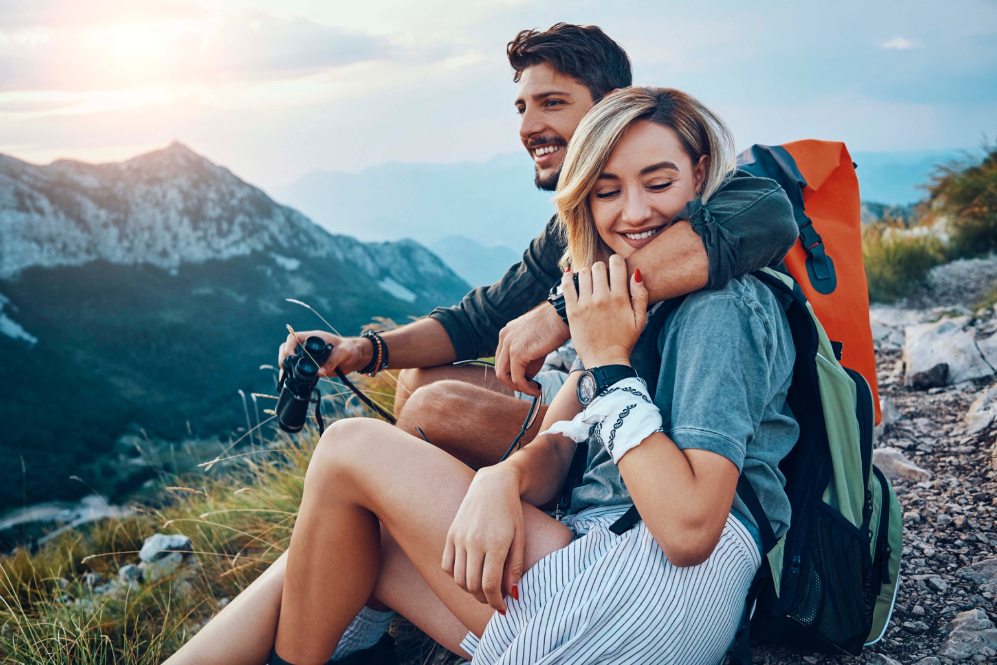 Couple resting together in the mountains