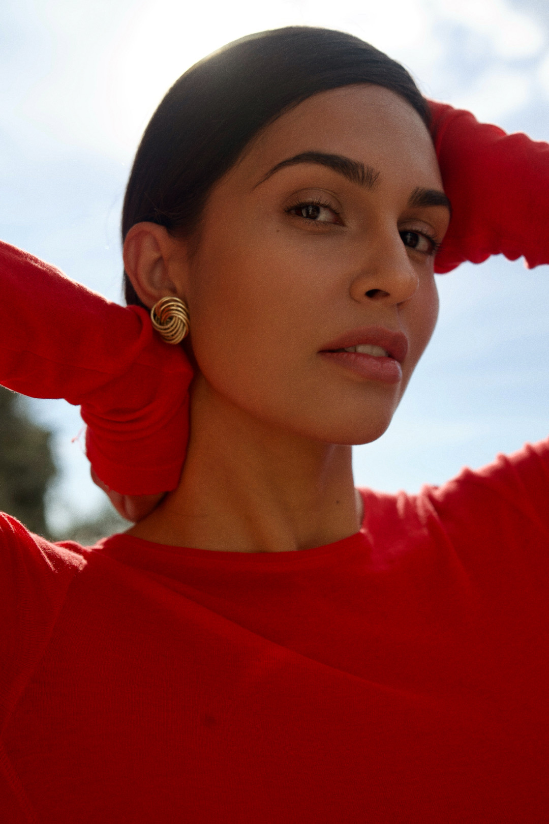 Expressive editorial portrait of a woman in red